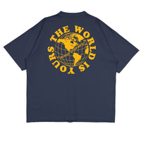 Heavyweight cotton tee in navy featuring the APT.4B Globe logo. Represents the brand's journey from local Queens roots to global influence.