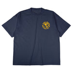 Heavyweight cotton tee in navy featuring the APT.4B Globe logo. Represents the brand's journey from local Queens roots to global influence.