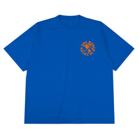 Heavyweight cotton tee in royal blue featuring the APT.4B Globe logo. Represents the brand's journey from local Queens roots to global influence.
