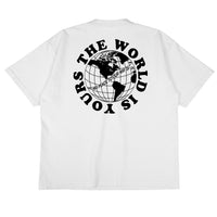 Heavyweight cotton tee in white featuring the APT.4B Globe logo. Represents the brand's journey from local Queens roots to global influence.