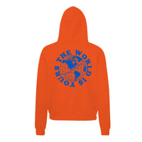 Heavyweight hoodie in orange featuring the APT.4B Globe logo. Represents the brand's journey from local Queens roots to global influence.