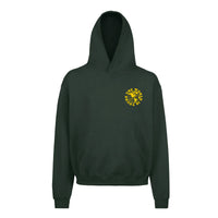 Heavyweight hoodie in green featuring the APT.4B Globe logo. Represents the brand's journey from local Queens roots to global influence.