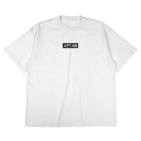 White tee featuring the classic APT.4B Dynamo box logo. Essential heritage streetwear with a clean, architectural design.