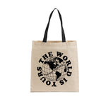 Heavyweight natural canvas tote bag featuring the APT.4B Globe logo. Durable everyday carry bag.