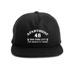 Black snapback cap with printed Rocksteady logo. Classic 5-panel construction representing NYC heritage.