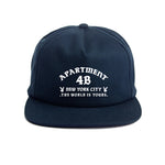Navy snapback cap with printed Rocksteady logo. Classic 5-panel construction representing NYC heritage.