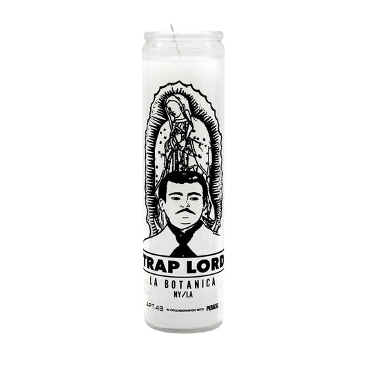 Hand-poured wax candle labeled 'Trap Lord' in bold typography. A lifestyle accessory for the modern street philosopher, adding ambiance to the Apartment.